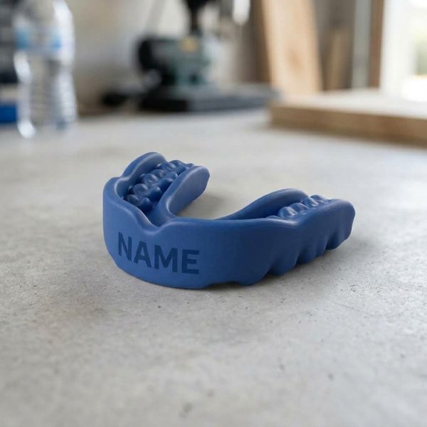 All-blue custom mouthguard with personalised name